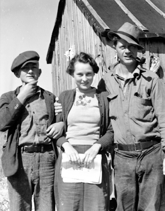 Elizabeth Turner (later Taylor) posing with Leonard Gillikin on the right and a young fisherman on the left, Brown's Island, N.C. Ms. Taylor thought the boy was mostly likely Moses Gillikin.