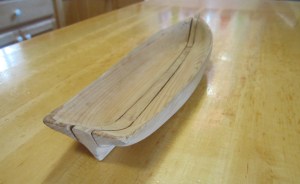 Model of a kunner demonstrating the split log construction technique.