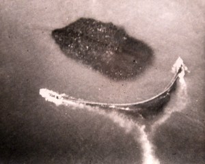Fishermen in a pair of purse boats (on the 2 ends of the big "U") pulling their seine toward a dense pack of tens of thousands of pogie, in the waters off Beaufort, N.C. 