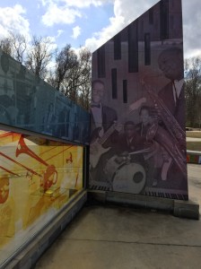 "Intersections," by David Wilson and Brandon Yow, uses old photographs, vintage maps & original artwork (some of it in the style of African American artist Romare Bearden of Charlotte) to honor Kinston's African American musical communities. 