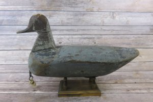 Redhead hunting decoy, early 20th century, by Charles K. "Tink" Tillett of Wanchese, N.C.. In addition to singing ballads, Tink Tillett was a well-known decoy maker. Both he and his wife shared"Her Bright Smile Haunts Me Still" with the Warners. Eleazar recorded the song with Martha Etheridge. This photograph is from a 2017 auction catalog. Tillett's redhead was sold for $450.