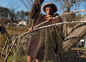 Historian and folklorist Alice Eley Jones displaying some of her father's bow nets when I interviewed her at her family's home in Murfreesboro, N.C. in 2006. Photo by Chris Seward. Courtesy, the Raleigh News & Observer