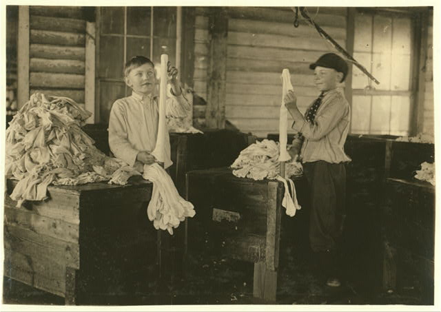 "Turners" at work at the Crescent Hosiery Mill, Scotland Neck, N.C. Lewis Hine identified the boy on the right as Joseph Allsbrook, age 11. Photo by Lewis Hine. Courtesy, Library of Congress, Prints and Photographs Division
