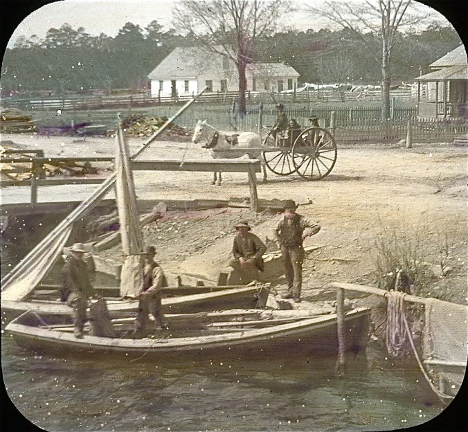 Albemarle &amp; Chesapeake Canal, 1901. This image is labeled as a road crossing, but the label does not indicate which crossing. Three roads crossed the canal: one in Great Bridge, Va., a second North Landing, Va. (also known as Cypressville and Roper City in the late 1800s); and the last in Coinjock in N.C. image by Albert Ross. Courtesy, Linda Garey