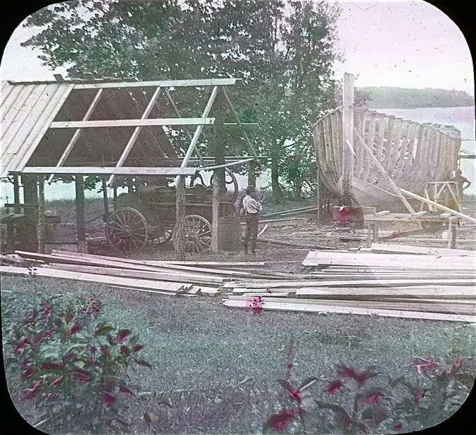 A shipyard on the James River, 1901. I'm not sure, but I suspect that the red smudges on the image come from rose tinting. Lantern slides were made long before the invention of color photography, so lantern slides were only black and white. To make their slides more appealing, lantern slide makers often tinted them with transparent colors after they were put on glass. Image by Albert Ross, USN. Courtesy, Linda Garey