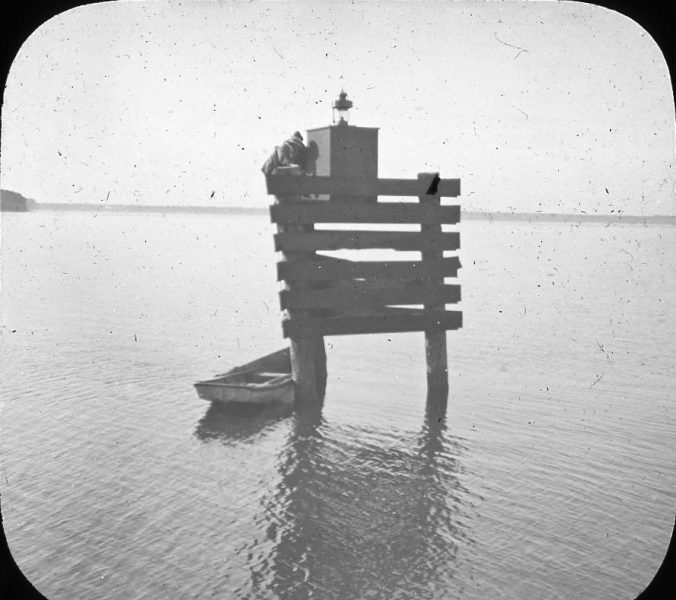 A lighted channel marker at an unknown locale in the U.S. Lighthouse Board's 5th District. Photo by Albert Ross, USN. Courtesy, Linda Garey