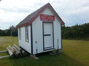 This 8 x 12 ft. post office served Salvo beginning about 1910, so it's not the one to which Capt. Bowser delivered mail in 1890. Nevertheless, it might give a sense of the kind of post office buildings common on Hatteras Island and other parts of the Outer Banks that time period. This was a movable building, and it would usually have been moved to the yard of whoever was the new postmaster or postmistress. 