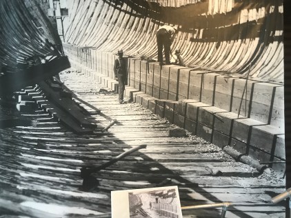 A wall of longleaf pine planking held together by forged iron drift bolts in the keelson of the 3-masted schooner Republic, Dunn & Elliot shipyard, Thomaston, Maine, 1900. Courtesy, Maine Maritime Museum