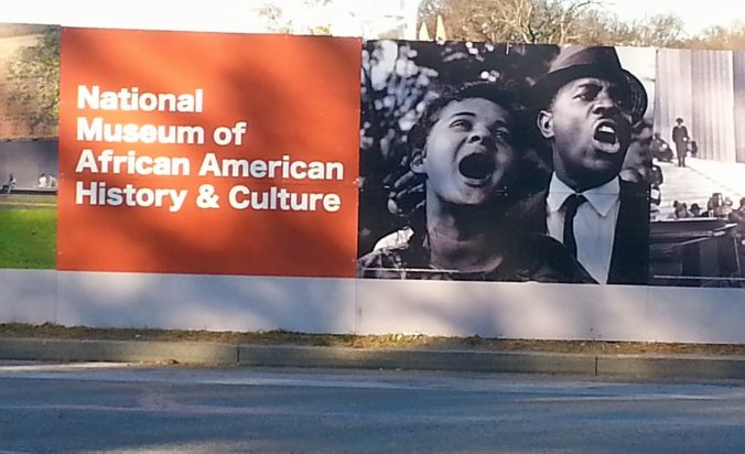 Museum billboard featuring Jacquelyn Bond (Shropshire) and Golden Frinks at the March on Washington in 1963.