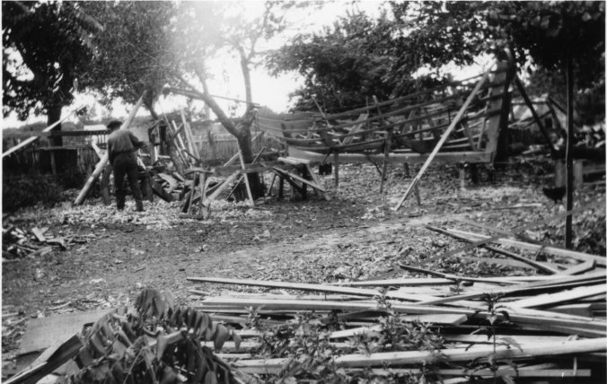 One of the Doughs working on a shad boat's spar at the family's boatyard on Roanoke Island, N.C., ca. 1930. Courtesy, Earl Willis, Jr.