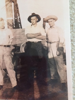 Howard Lee (middle) and two friends by the spuds on the stern of the dredger Clinton ca. 1927-33. Courtesy, the Lee family