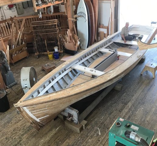 Overhead view of a curmudgeonly historian sitting in the shad boat Ella View at the N.C. Maritime Museum's boat shop in Beaufort, N.C. She was there for routine maintenance but is usually housed at the Roanoke Island Maritime Museum in Manteo, N.C. Photo by Tom Earnhardt