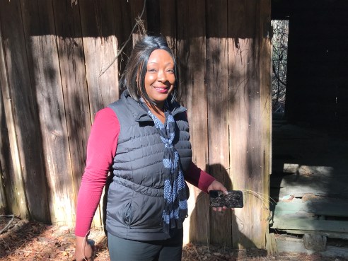 Marion Evans exploring an old cabin in the woods near Supply, N.C. Photo by David Cecelski