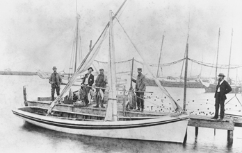 Fishermen posing with their shad boat and catch, Manteo, N.C., ca. 1900. Courtesy, State Archives of North Carolina
