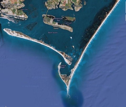 Aerial view of Cape Lookout and Lookout Bight, where Russell Coles anchored his houseboat every summer. The Cape is at the southern end of Core Banks. An inlet, opened by a hurricane in 1933, now connects the Atlantic and the Bight with Back Sound. In Coles' day, Shackleford Banks (the barrier island running west of Core Banks) and Core Banks ran together. Image courtesy, The View from the Pizer