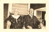 A later photograph of Capt. Charlie Willis and his wife, Elenous Guthrie Willis, on the front porch of their home at 1204 Shephard St. in the Promise Land, Morehead City, N.C. The couple raised 9 children there. Courtesy, the Promise Land Society