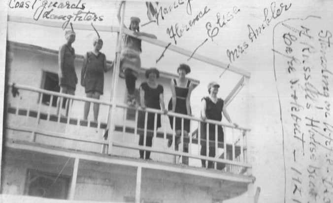 Young women at Coles' houseboat, Cape Lookout, 1921. . From right to left, Mrs. Ambler; Elisa, Florence and Marcy (no last names) and a pair of young daughters of coastguardsmen. Photo courtesy, Walter Coles, Sr., Chatham, Va.