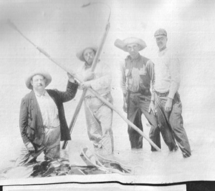 Russell Coles, Teddy Roosevelt and two of Coles' crewman from Morehead City, N.C.-- Roland Phillips and Mart Lewis. Near Punta Gorda, Fl., 1917. Courtesy, Walter Coles, Sr., Coles Hill, Va.