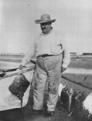 Russell Coles with a skate (Rajas sp.) and fish for his dinner, Cape Lookout vicinity, ca. 1910. Courtesy, Walter Coles, Sr., Coles Hill, Va.