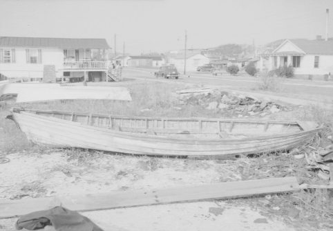 A later view of the edge of the Promise land in the 1940s. The boat in the foreground was said to be the last whaleboat used on the North Carolina coast. Its captain was John E. Lewis. Photo courtesy of the North Carolina Museum of History