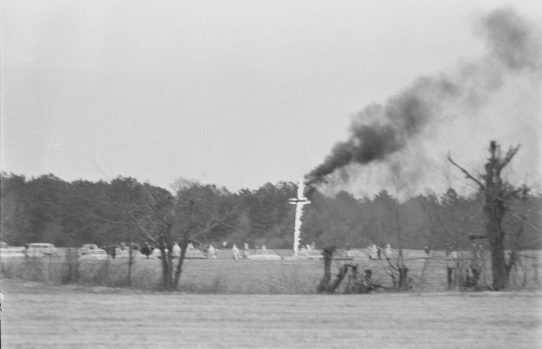 Klansmen burning a cross in the daylight in Pitt County, N.C., not far from Ernul, in March 1966, a month before the bombing of the Cool Springs FWB Church. From The Daily Reflector Photographic Files, ECU Digital Collections