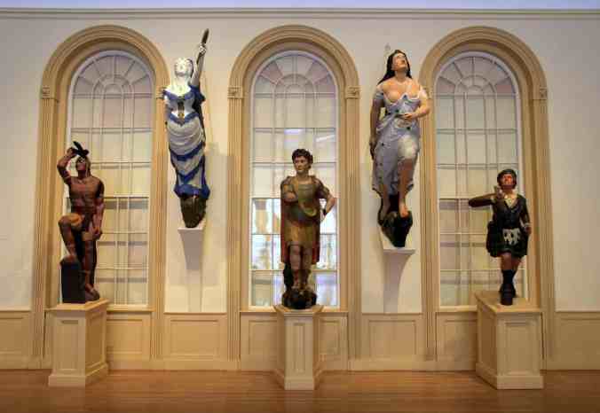 Collection of ship mastheads in the East India Marine Hall, Peabody Essex Museum, Salem, Mass. Courtesy, Peabody Essex Museum