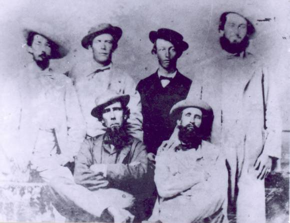 This jaunty group of Cape Fear River pilots includes men that were blockade runners during the Civil War. Thomas Newton (left) and Julius Dosher are sitting in the front, while Joseph Newton, an unknown young man, Joseph Bensel and Thomas Brinkman stand behind them. Courtesy, New Hanover Co. Public Library, NC Room. Identifier #00.037