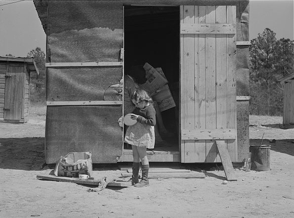 Near Fayetteville, N.C., 1941. This young girl's family rented this little shack for $5 a week while her father worked at Fort Bragg. Photo by Jack Delano. Courtesy, Library of Congress