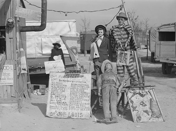 The "Crime Museum" was one of the traveling tent shows that followed the construction workers to the Fayetteville area. Jack Delano, the photographer, described the tent show's owner as "an old shell-shocked World War veteran." Courtesy, Library of Congress