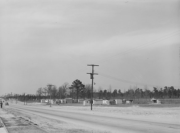 View of camp of Ft. Bragg construction workers and their families on the Fayetteville-Ft. Bragg road, 1941. Photo by Jack Delano. Courtesy, Library of Congress