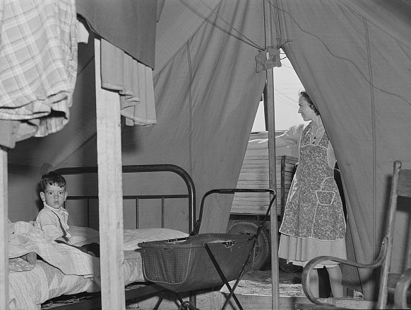Migrant camp near Fayetteville, N.C., 1941. This family traveled all the way from South Texas so that this woman's husband could get work at Ft. Bragg. Photo by Jack Delano. Courtesy, Library of Congress