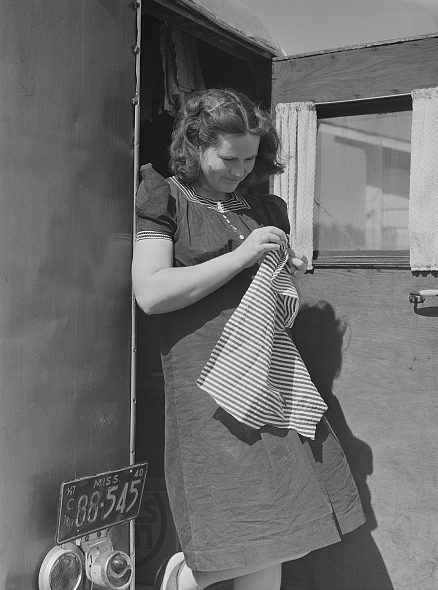 Near Fayetteville, N.C., 1941. The photographer, Jack Delano, described this woman as a "former circus performer." She was traveling with her husband, a construction worker at Ft. Bragg. Their trailer's license plate is from Mississippi. Courtesy, Library of Congress