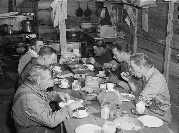 Migrant construction workers eating supper at a trailer camp near Fayetteville, N.C., 1941. Photo by Jack Delano. Courtesy, Library of Congress