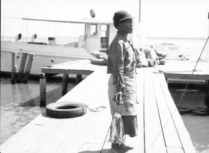 Colerain, N.C., ca. 1937-41. Nobody got rich cleaning herring, but the women always appreciated the chance to take home a few fish. In hard times, they could mean the world. Photo by Charles A. Farrell. Courtesy, State Archives of North Carolina 