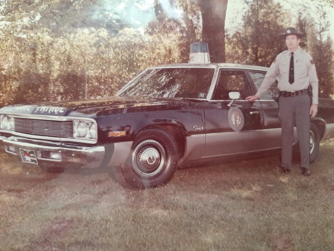State Trooper Bobbie "Bob" Edwards with his patrol car in 1974. Photo courtesy, Mr. Edwards