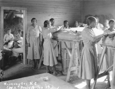 An Emergency Relief Administration (ERA) pine straw mattress factory in Wilmington, N.C., ca. 1934. The ERA was a predecessor of the WPA. Courtesy, State Archives of North Carolina