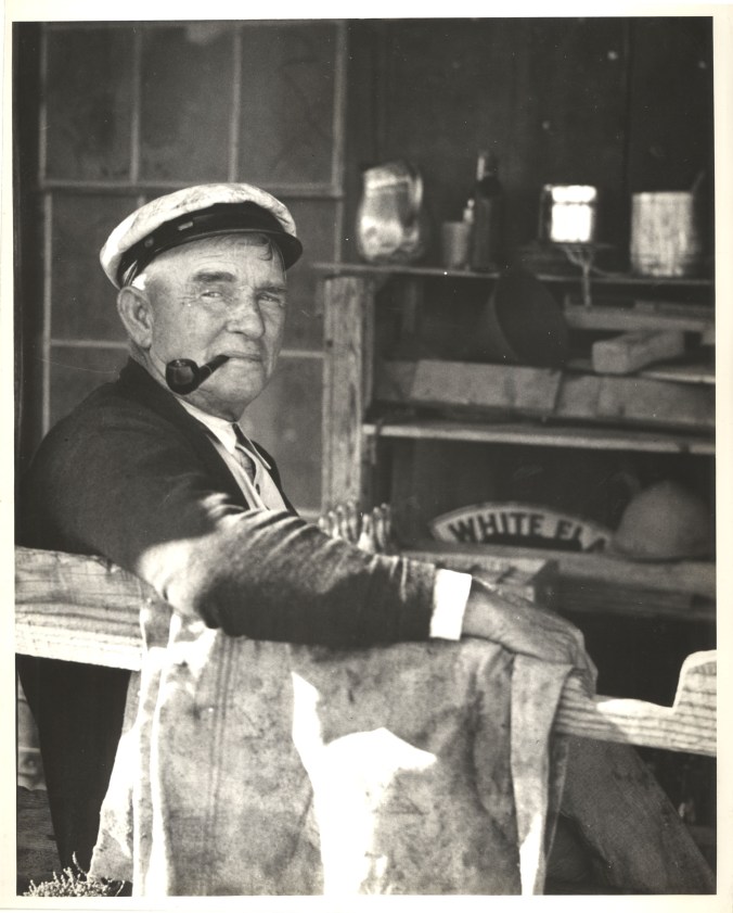 Ginny Richardson told me that Ramp Jones used to stop by her home every day on his rounds through the village. "He was impatient with children," she said. Several people told me that Jones had served in the Coast Guard in his younger days. Some thought he had also served on merchant ships and/or the U.S. Navy. He apparently spent many an hour on this porch with his pipe. Photo by Charles A. Farrell. Courtesy, State Archives of North Carolina