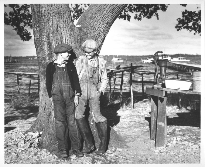 History is in the details. An avid local historian named Freddie Midgette told me that these two young men must have been out of towners because they weren't wearing "Sneads Ferry sneakers"-- white rubber boots. I have to give him credit: I asked quite a few people if they could identify these two delightful young men, and none could. Photo by Charles A. Farrell. Courtesy, State Archives of North Carolina