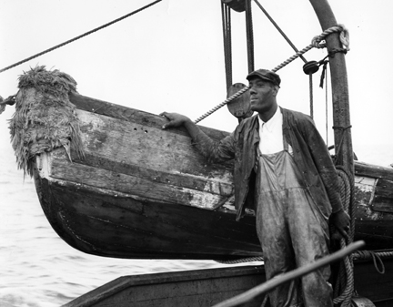 Elias "Nehi" Gore on the W.A. Anderson in waters off Southport, N.C., ca. 1939. Photo by Charles A. Farrell. Courtesy, State Archives of North Carolina