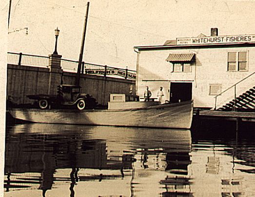The Whitehurst fish house and one of the family's fishing tugs on the Vermilion River in Vermilion, Ohio, ca. 1930-48.