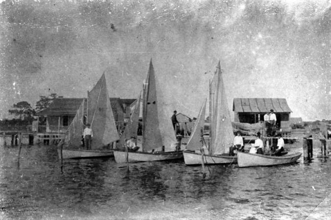 Fishermen and spritsail rigged sailing skiffs, Cortez, Fl., 1900-1903. Courtesy, Manatee County Public Library