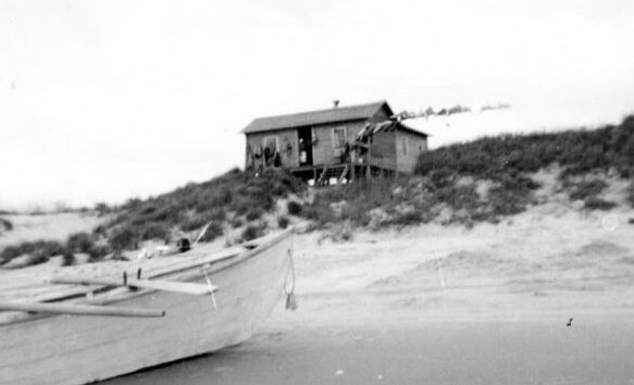 Mullet fishing camp and pilot boat (probably Harkers Island-built) Salter Path, N.C., 1935-40. Photo by Charles A. Farrell. Courtesy, State Archives of North Carolina