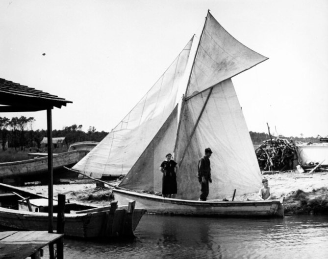 A family getting a lovely little spritsail skiff ready for a trip up the sound, Wanchese, N.C., ca. 1989-39. Photo by Charles A. Farrell. Courtesy, State Archives of North Carolina