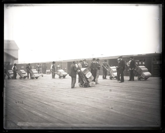 Loading boxes of herring onto railway cars at the railroad station, Edenton, N.C., 1881 (from 8 x 10" glass negative). Smithsonian Institution Archives, Acc. 11-006, Box 015, Image No. MAH-4913