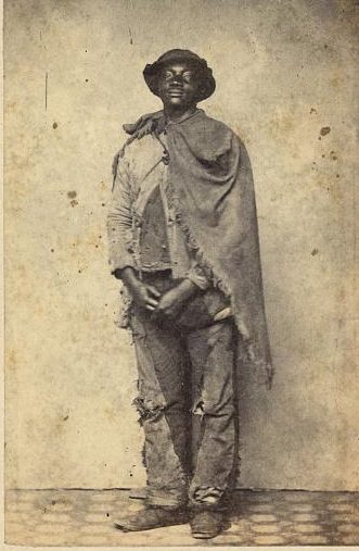 William Heady, New Bern, N.C., June 1864. According to an inscription on the back of this photograph, he escaped from a plantation near Raleigh and “arrived at Newberne [sic] N.C. on the 20th May 1864 having been six weeks on the road, neither sleeping or eating in a house during the time.” He was one of thousands of escaped slaves that made their way to New Bern and Beaufort during the Civil War. Courtesy, Library of Congress