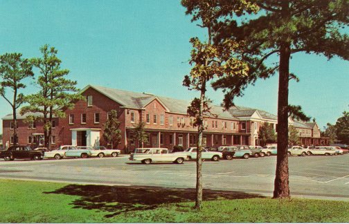 Postcard of the PX at the Cherry Point MCAS, 1964. The PX, Mess Hall, recreational facilities, housing and all other facilities at Cherry Point had been racially integrated after Pres. Truman's Exective Order 9981 in 1948. The contrast between the racial situation on base and off-base often led black servicemen to get involved in civil rights activism in nearby civilian communities. Postcard image from http://www.cherrypointatc.com/ATCWeb/postcards.htm