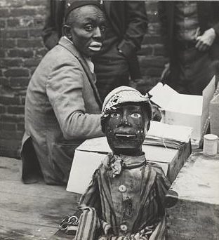 Medicine show performer in blackface and an African American puppet, Huntington, Tennessee, 1935. Photo by Ben Shahn. Courtesy, Library of Congress