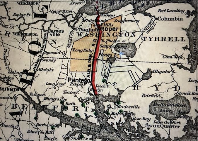 Map of the Albemarle &amp; Pantego Railroad (G.W. and C.B. Colton &amp; Co.), 1887. Courtesy, Library of Congress. The shaded portion of the map shows the approx. 140,000 acres of the East Dismal Swamp that the John L. Roper Lumber Co. purchased from the descendants of Josiah Collins who, relying on enslaved Africans and draft animals-- oxen, horses and mules-- had dredged canals and cut a significant part of the old-growth swamp forests beginning in the late 1700s. After purchasing the land, the Roper Lumber Co. built the Albemarle & Pantego Railroad ca. 1881-87 to serve as the backbone of its extensive logging operations on that part of the N.C. coast. The Norfolk & Southern Railroad-- of which John L. Roper was a leader-- later purchased the railroad and expanded the line from Mackey's Ferry to Belhaven ca. 1891. 