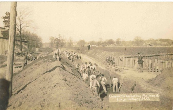 By 1935, the vast majority of convict laborers were forced to work either on the state's roads or on farms. In an earlier era, though, thousands of convict laborers worked on railroad construction projects. This scene is from Scotland County, N.C., ca. 1900. Photo courtesy of Henry McKinnon. From <a href="https://growingchangehistoryproject.org">The Growing Change History Project</a>, a public history project created to support the research and interpretation of a former prison in Wagram, N.C.