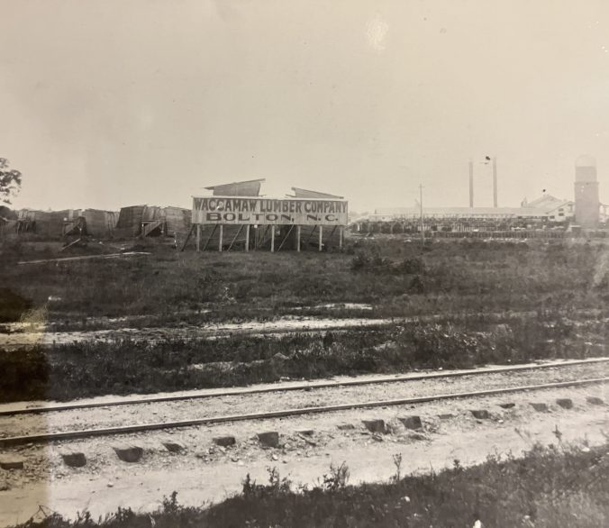 Waccmaw Lumber Co., Bolton, N.C., ca. 1910-20. The tall structure on the far right is the wood-burning furnace that powered the mill's saws. From Waccamaw Lumber Co. Photographic Album and Journal, Rubenstein Library, Duke